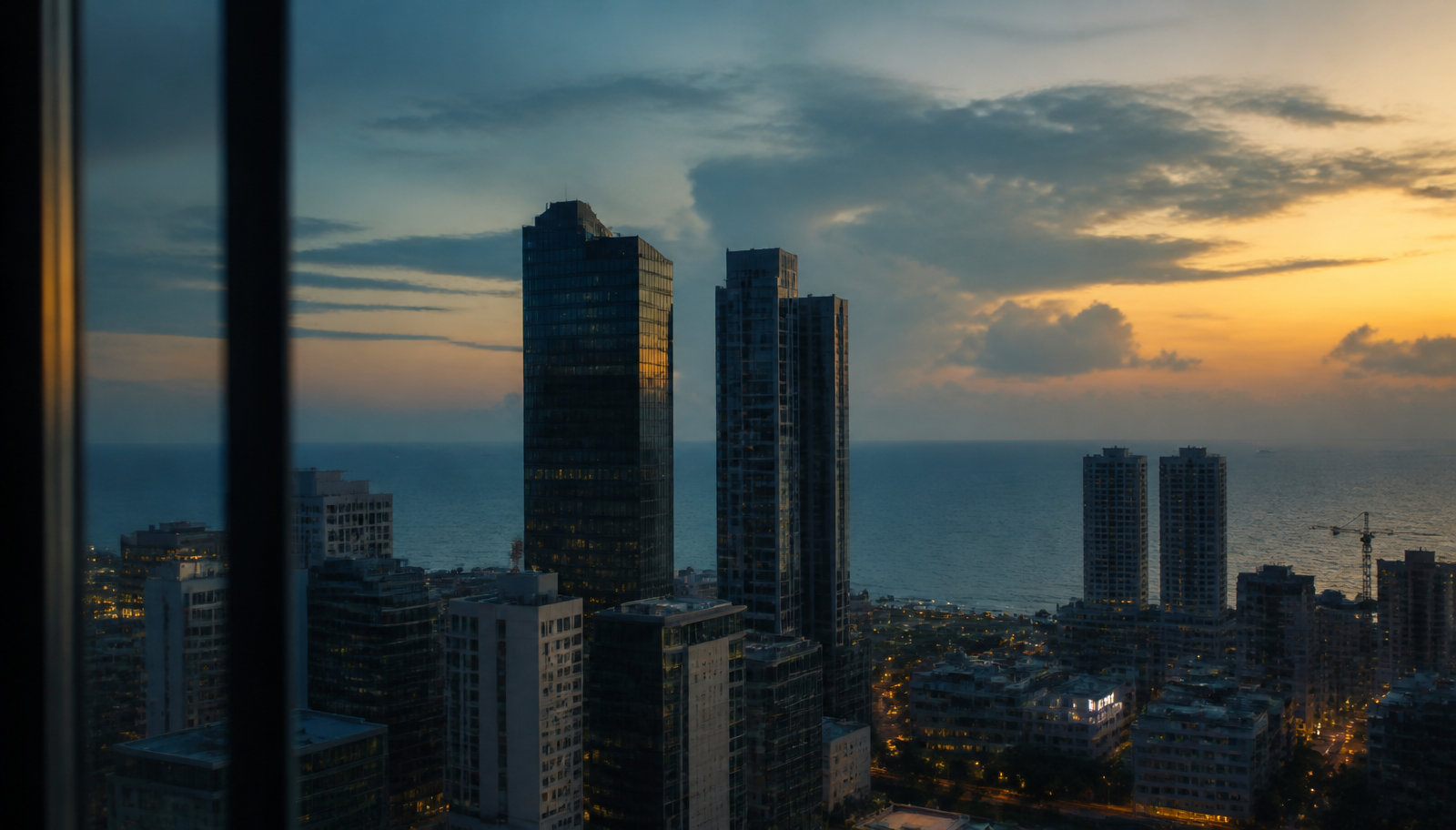 Colombo business district at dusk with the Indian Ocean beyond